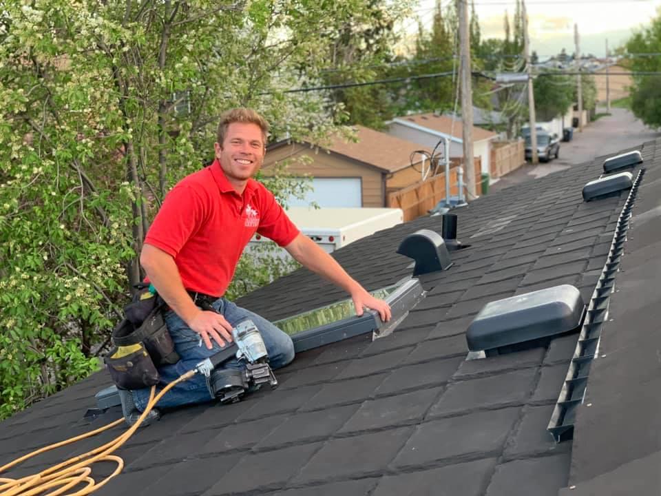 Real Canadian Roofing roofer checking a roof in Calgary